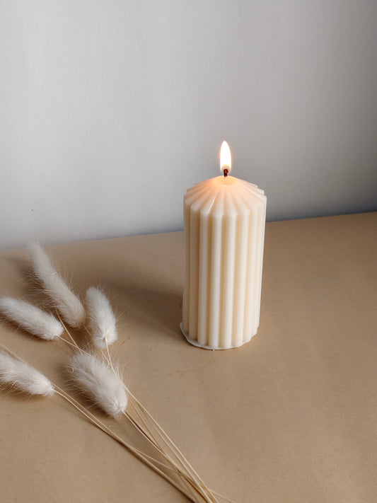 Fluted pillar candle with ribbed finish