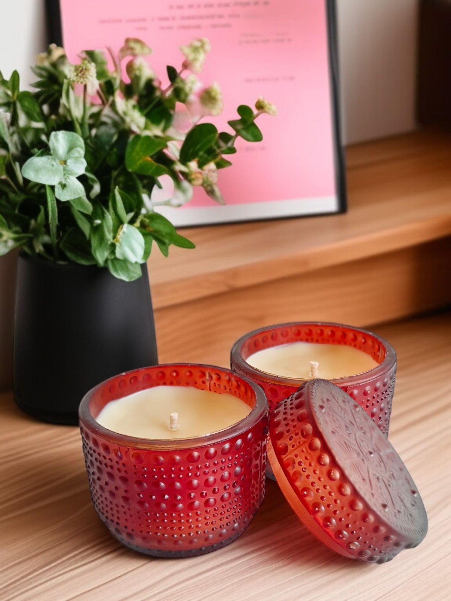 Brown dotted jar candle on a wooden table