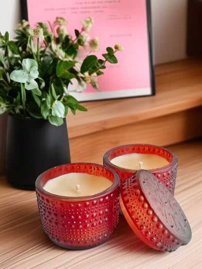 Brown dotted jar candle on a wooden table