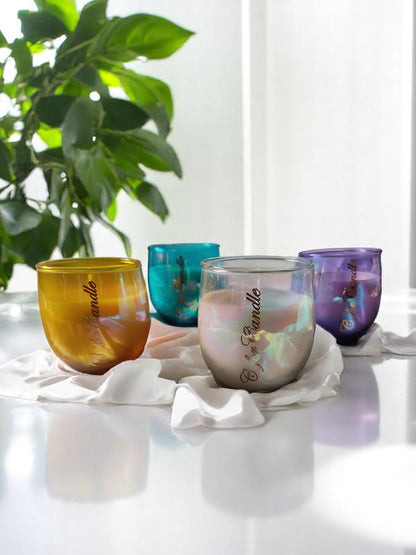 Holographic u-shaped glass jars on a white cloth