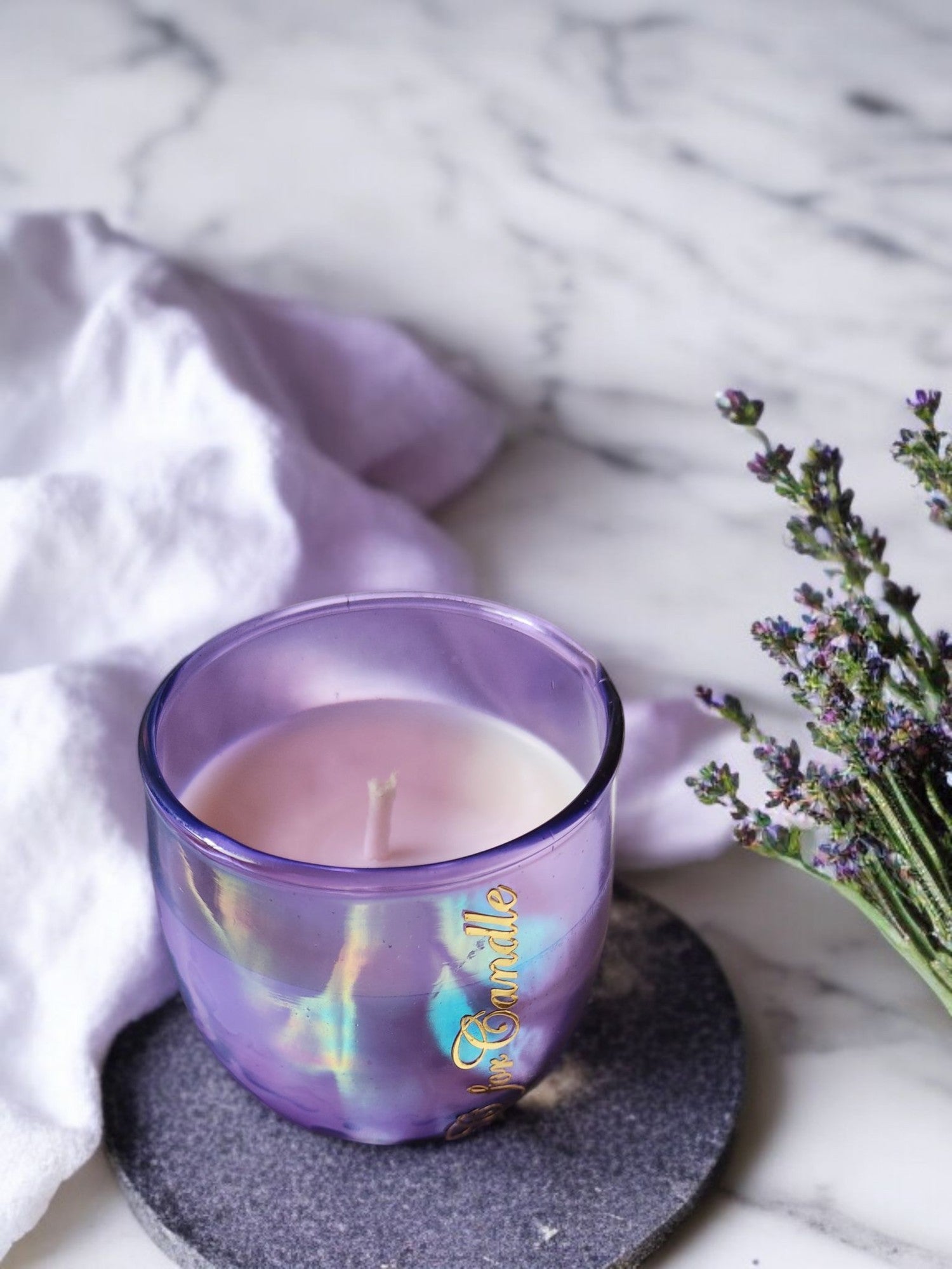 Purple holographic glass jar on a coaster