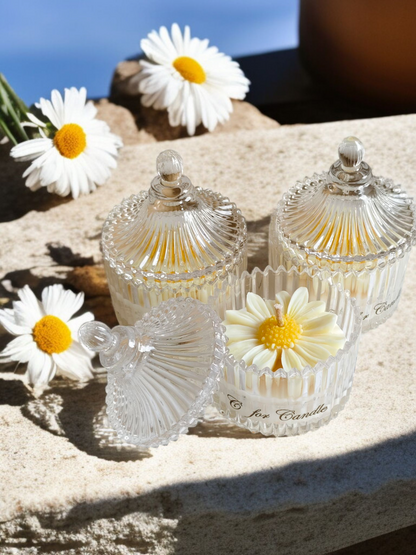 Daisy flower candle in a crystal glass jar