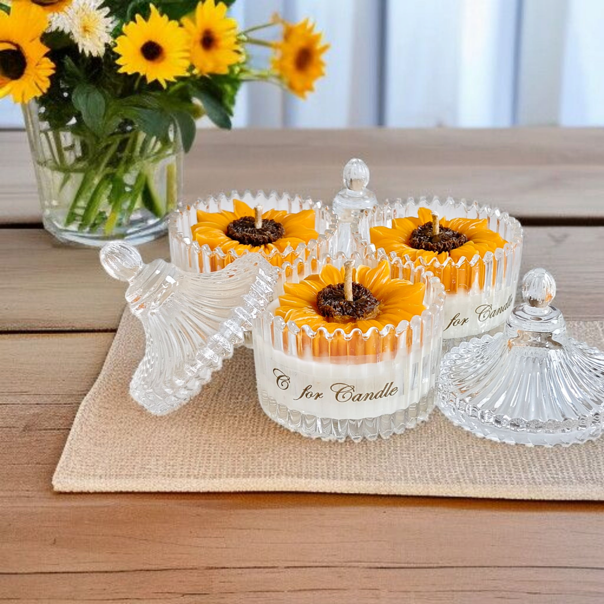 Sunflower candle in a crystal glass jar